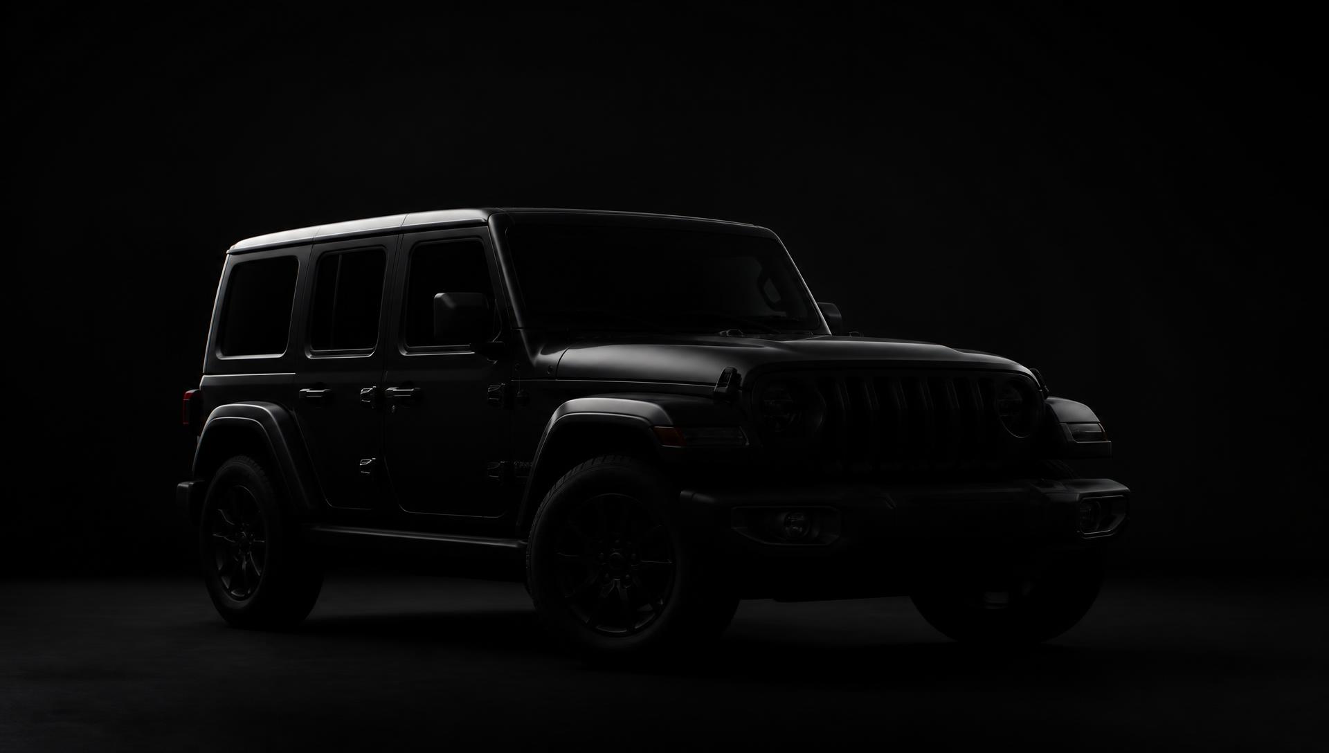 Blacked-out Jeep-style SUV in low, moody studio lighting